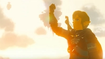 Link raises a clenched fist skyward. 