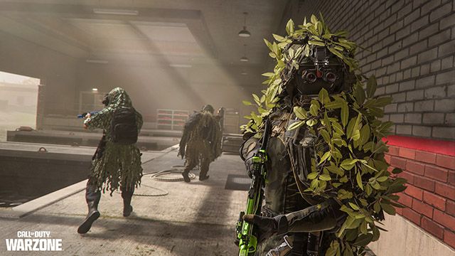 Screenshot of Warzone players searching abandoned dock wearing ghillie suits