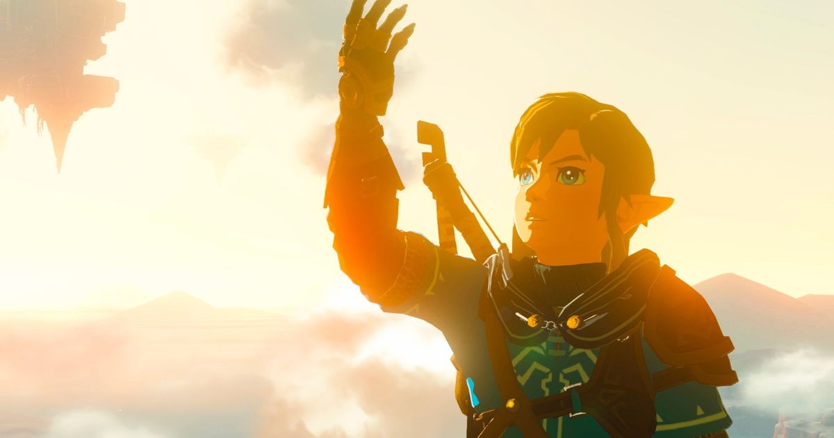 Link holding up his arm in Zelda Tears of the Kingdom.