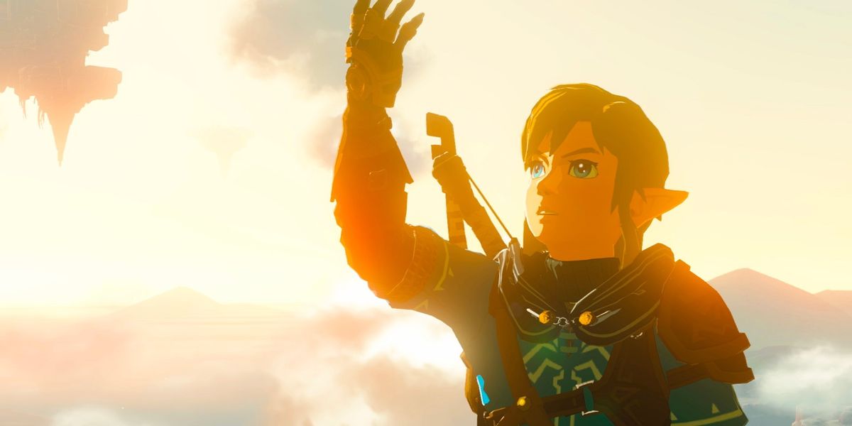 Link holding up his arm in Zelda Tears of the Kingdom.
