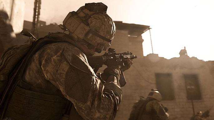 Image showing Modern Warfare player aiming down sights at broken building