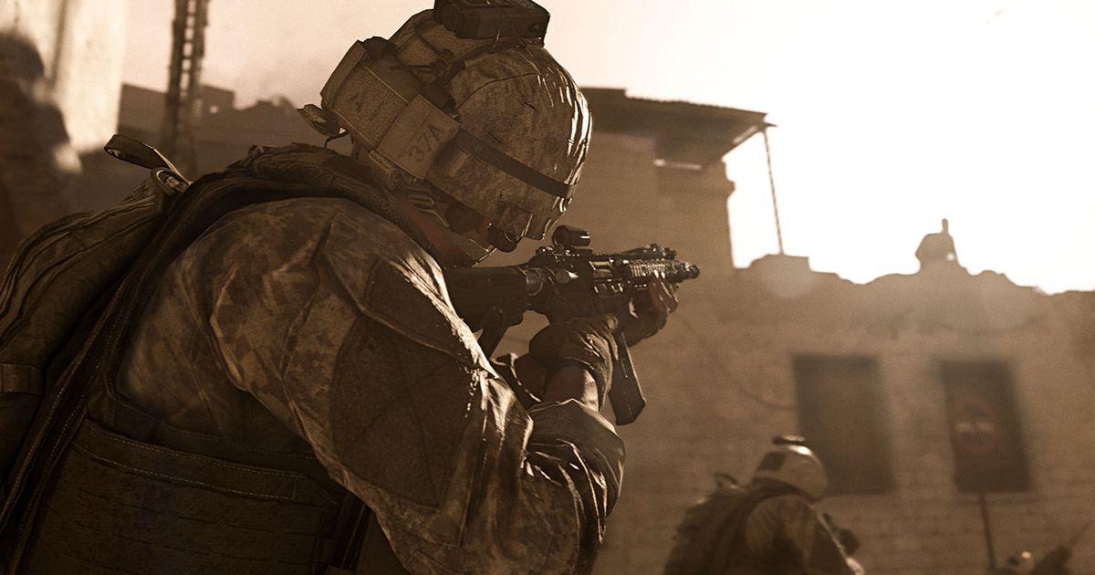 Image showing Modern Warfare player aiming down sights at broken building
