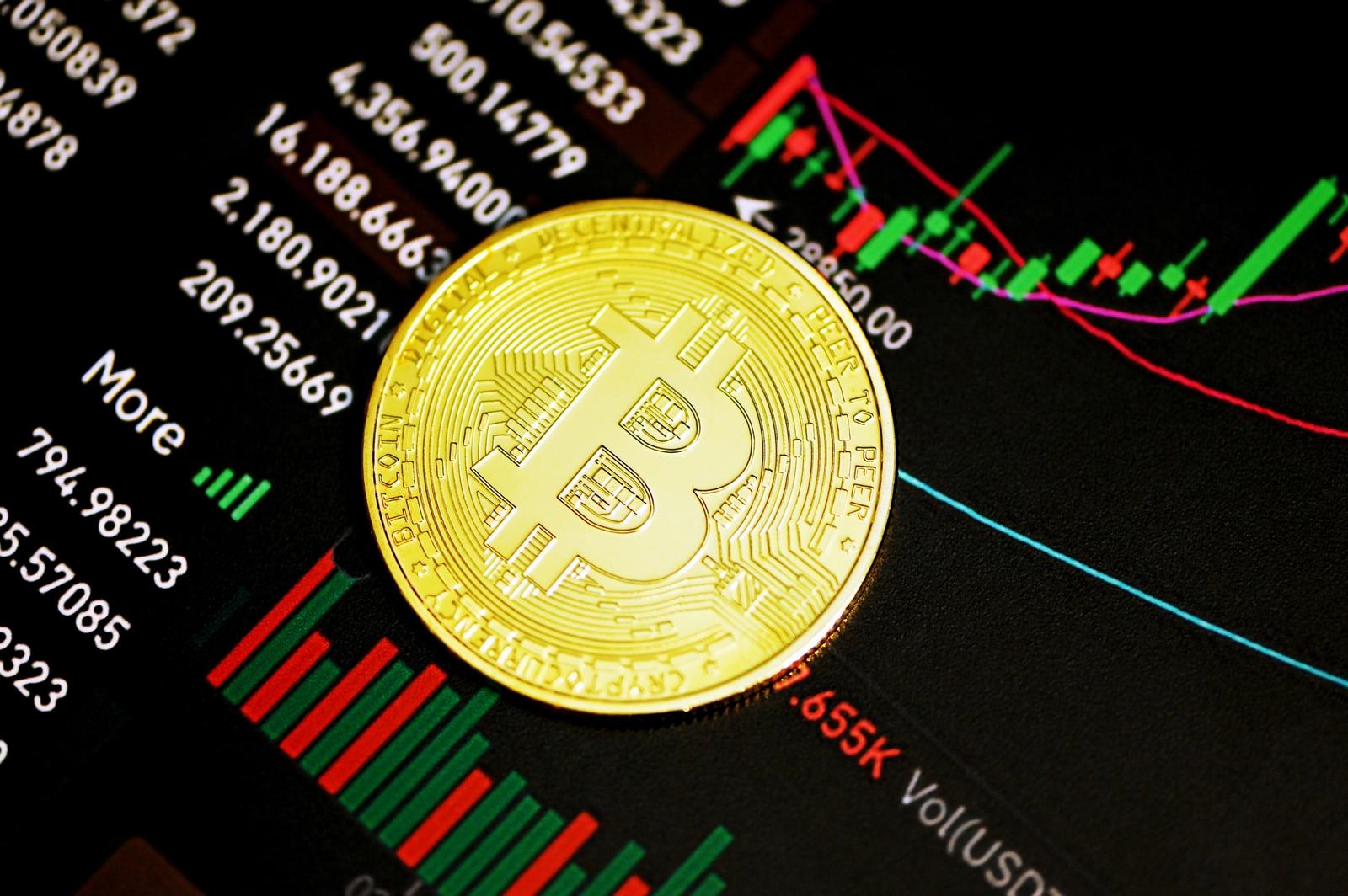 a gold bitcoin token on a graphical surface