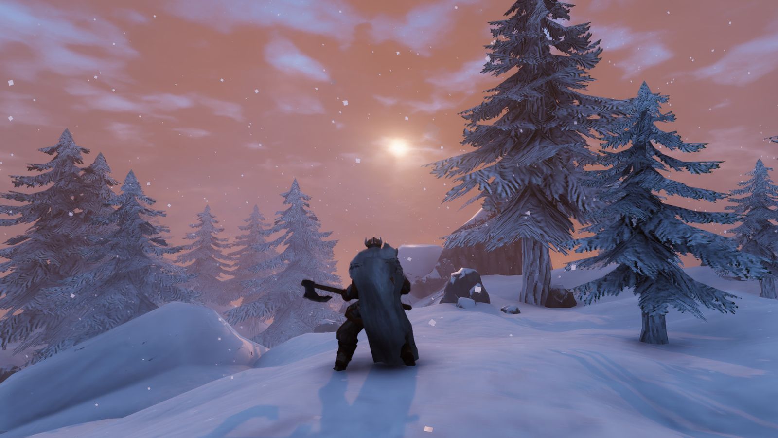 A player standing in the frozen wastes of Valheim. They have their axe drawn and are facing away from the camers