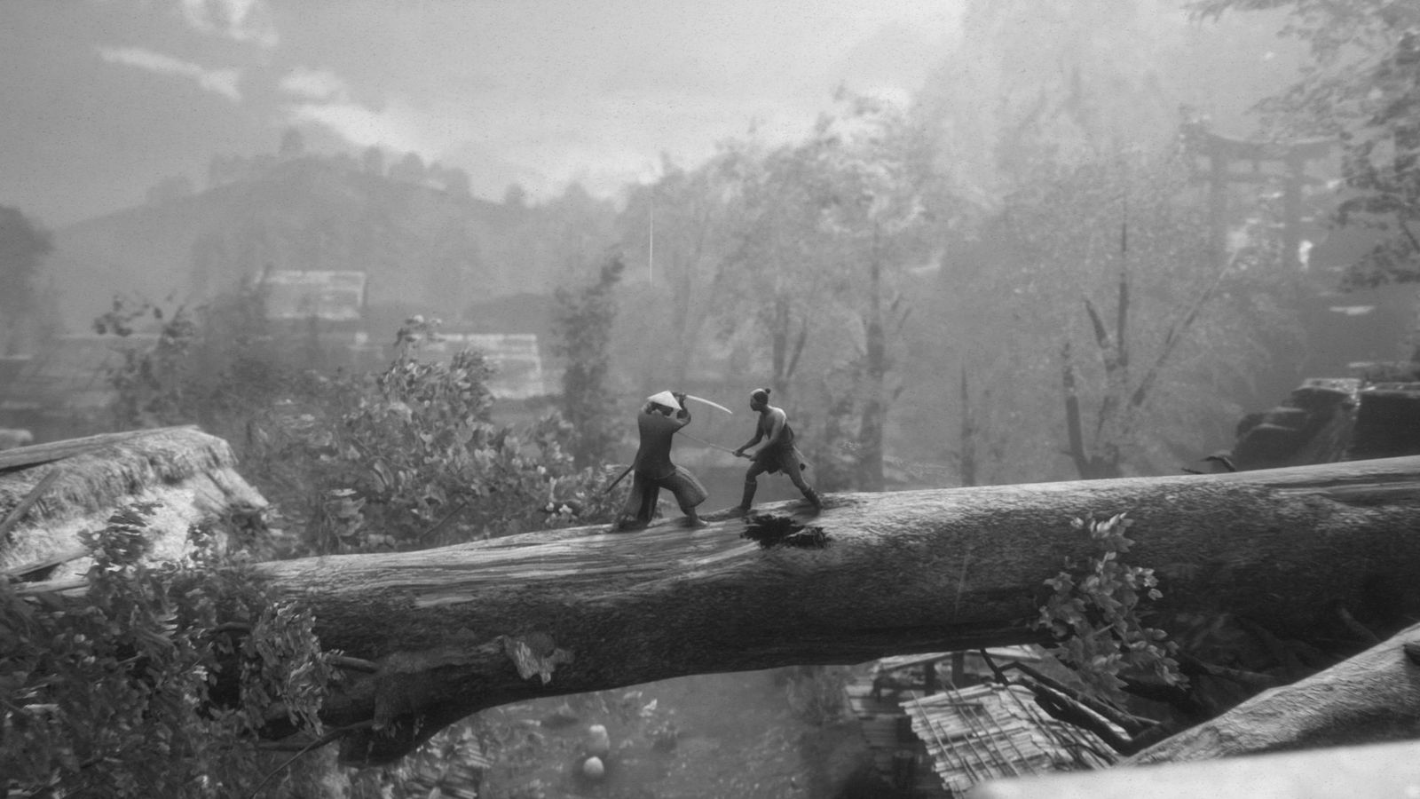 Two warriors fight on top of a fallen tree.