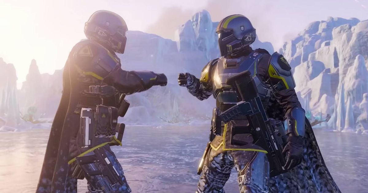 Two Helldivers giving each other fist bumps with icy cliffs in the background.