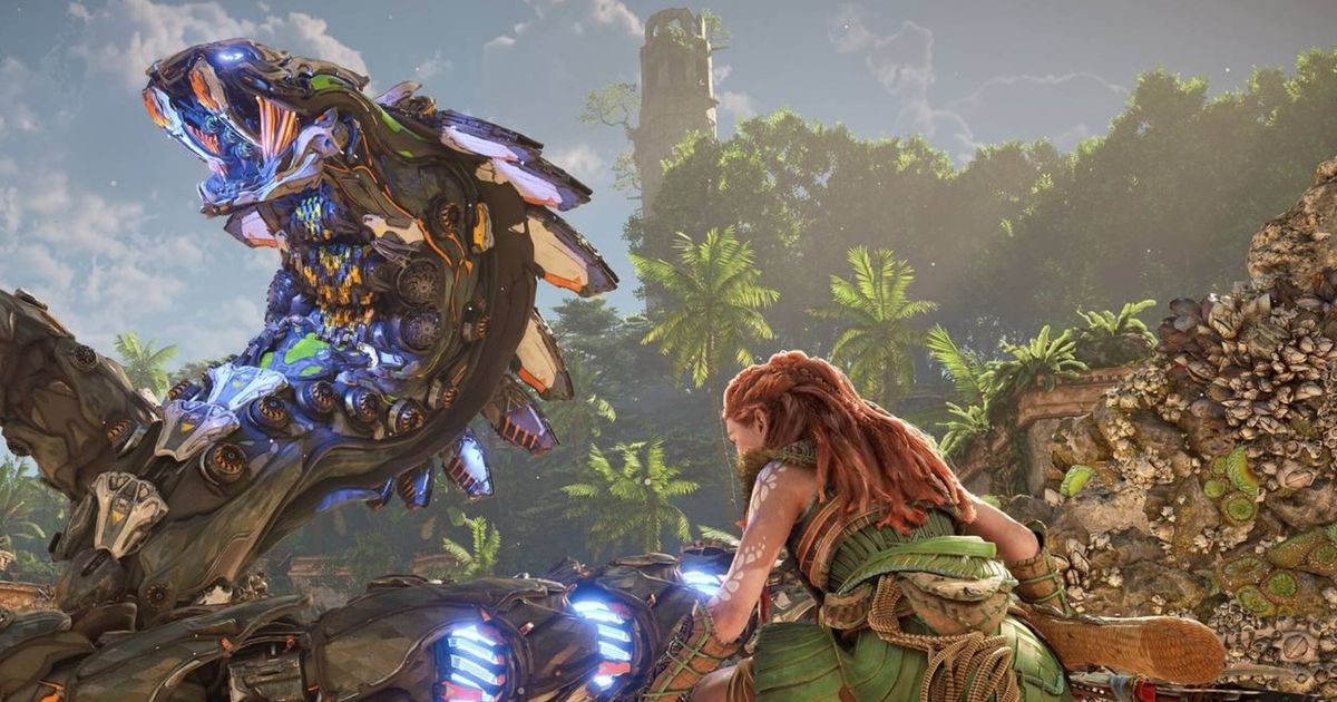 Horizon Forbidden West Aloy vs a Slitherfang. Aloy is crouching in the foreground of the image as the large snake-like machine has reared up and is hissing in the background. 