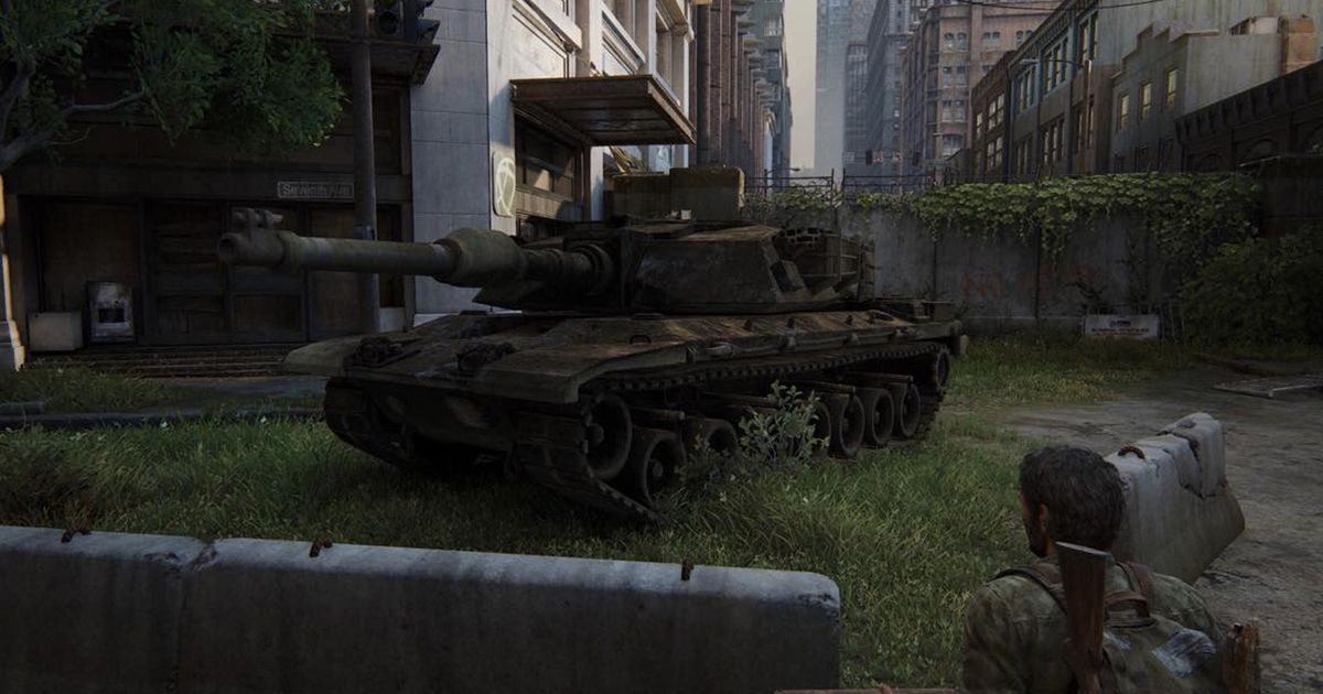 Image of Joel looking at a tank in The Last of Us Part I.