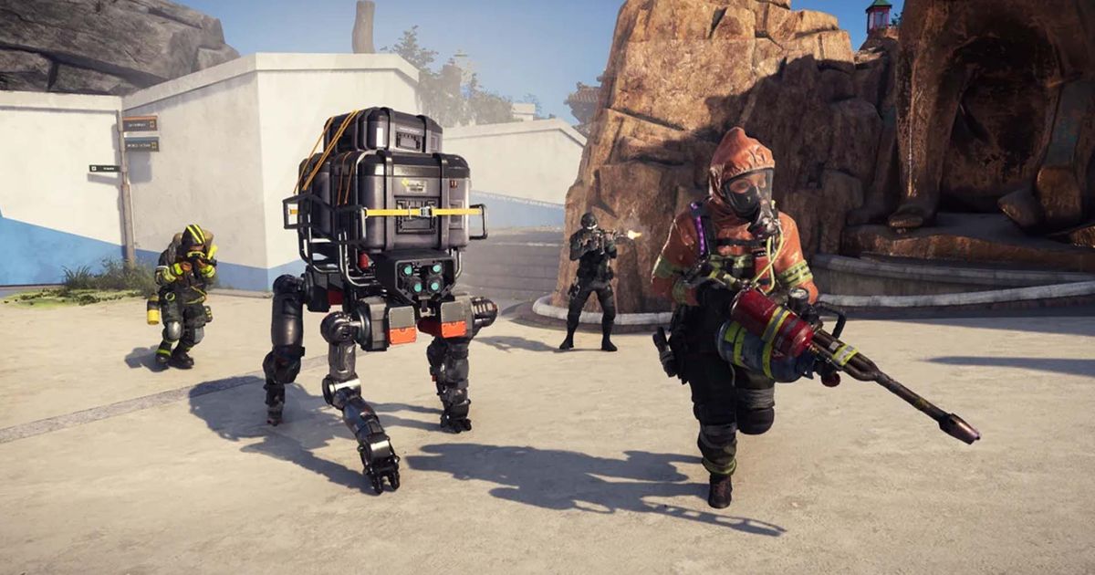 Screenshot of XDefiant player holding flamethrower next to robot with legs. Other XDefiant players holding guns are in the background