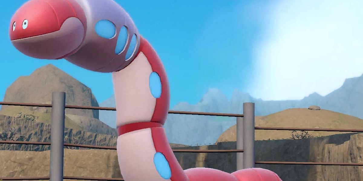 Image of the Pokemon Orthworm stood on a grassy hill.
