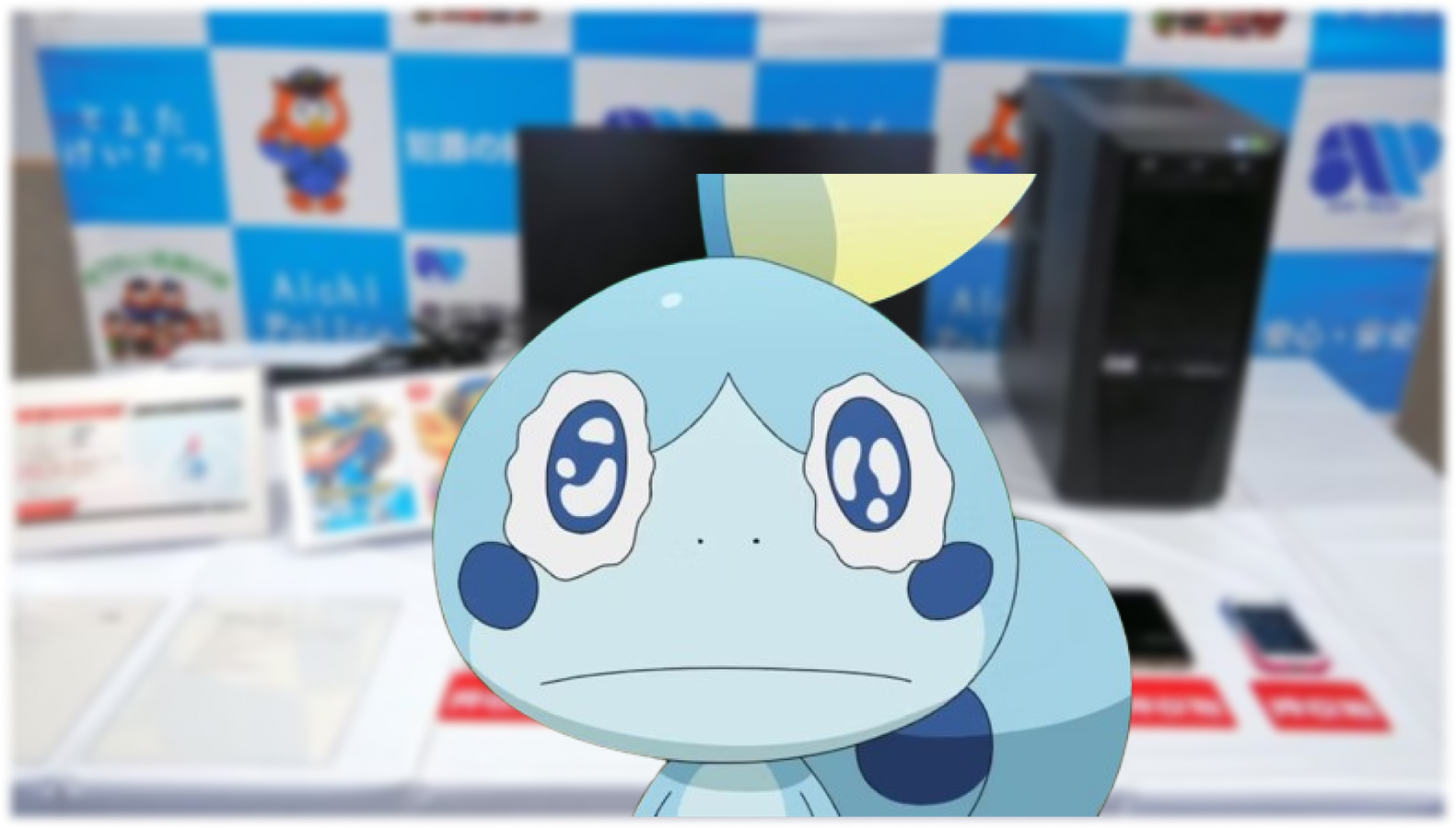 sobble blue lizard pokemon crying in front of nintendo stand