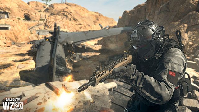 Screenshot showing Warzone 2 player firing Cronen Squall battle rifle near an aeroplane wreckage