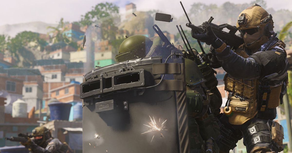 Modern Warfare 3 player firing gun with player holding riot shield in foreground
