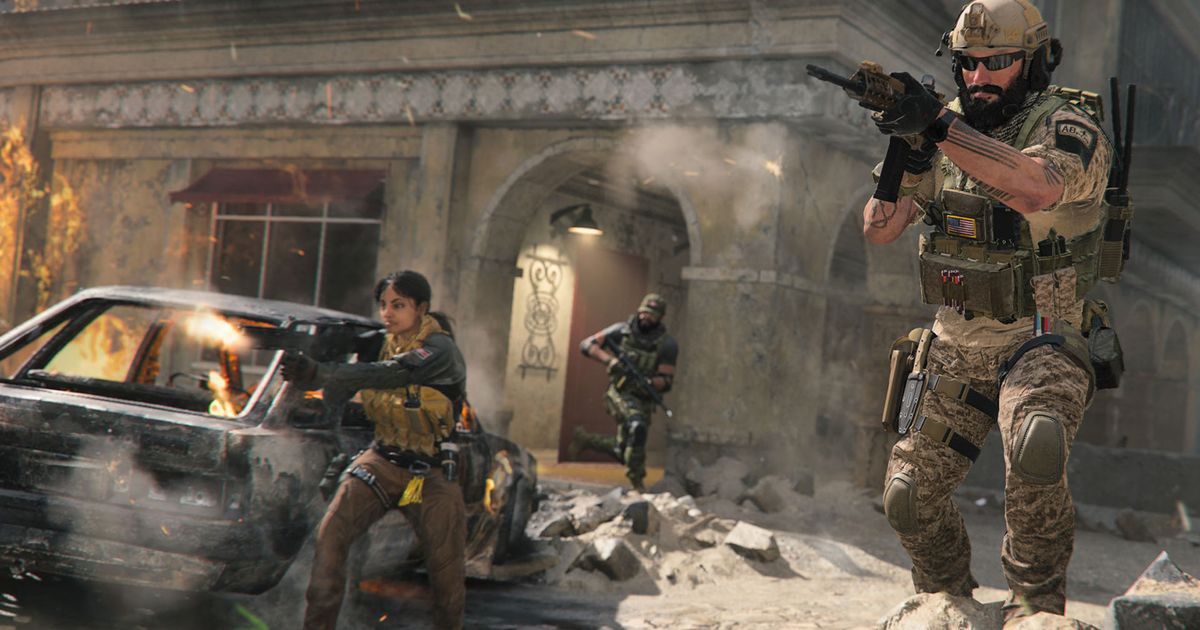Modern Warfare 3 player holding assault rifle with teammates in background