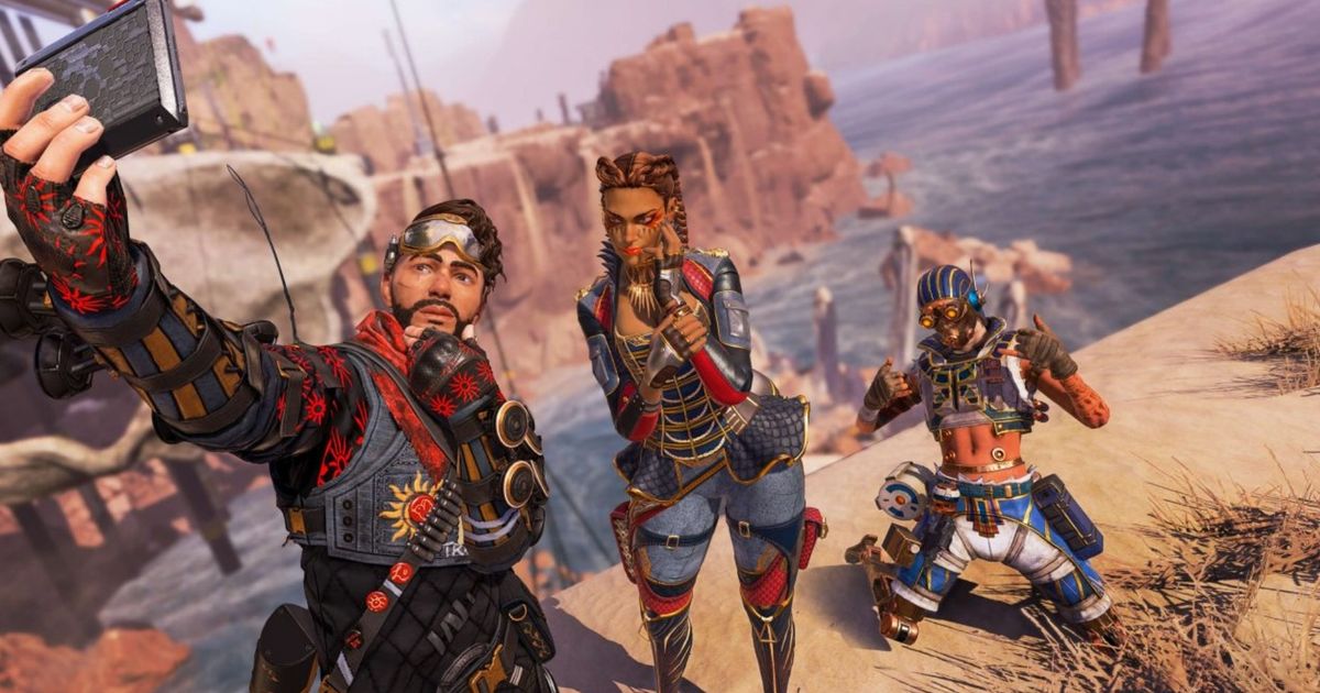 Apex Legends Mirage Loba and Octane taking a selfie in Kings Canyon. They are all wearing red-themed skins.
