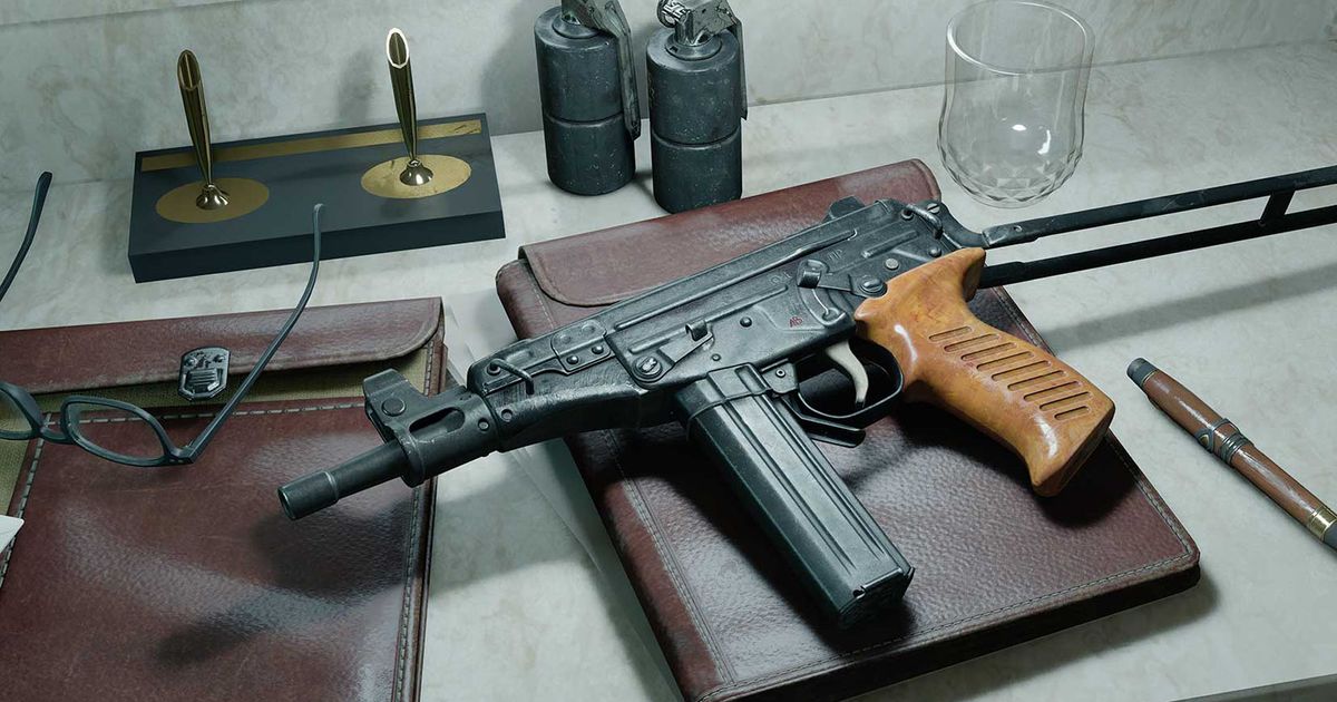 Screenshot of OTs 9 submachine gun on top of notebook placed on white desk near pen