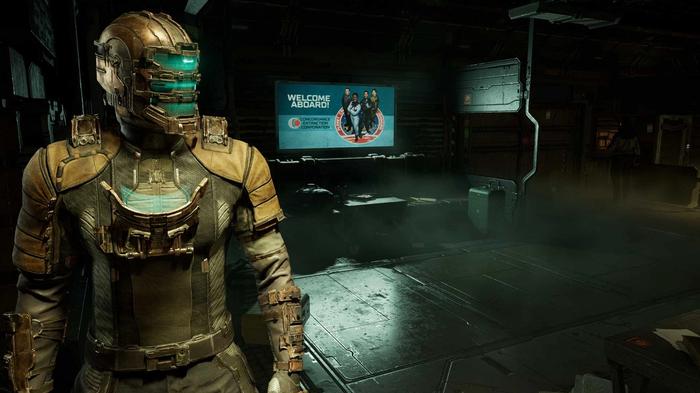 Isaac Clarke facing away from a glowing billboard in the Dead Space remake.
