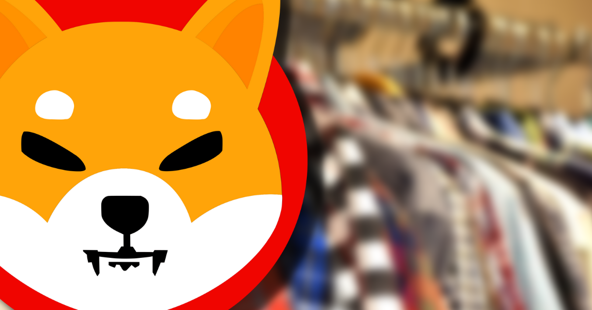 Image of Shiba Inu Logo in front of clothes rack of shirts