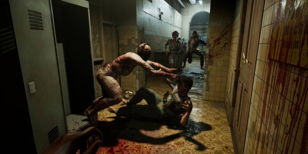 Enemies attacking a player on the ground in The Outlast Trials.
