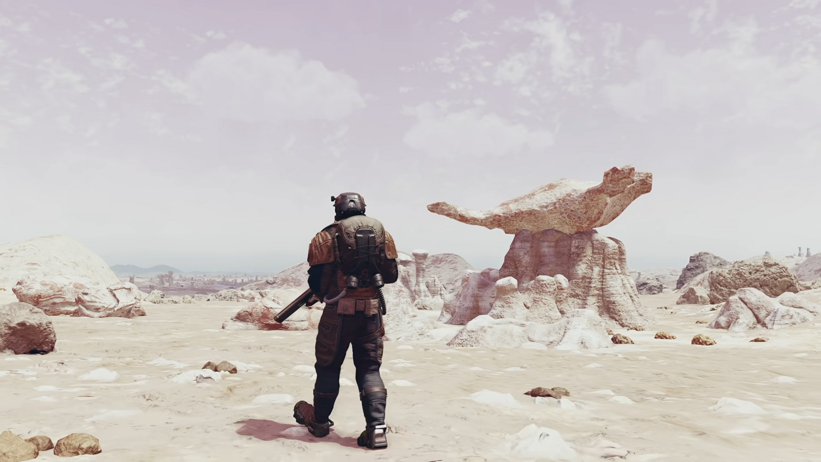 A character walking across a rocky planet in Starfield.
