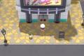 A Pokémon trainer stands outside the Jubilife TV Centre of Jubilife City in Pokémon Brilliant Diamond and Shining Pearl.