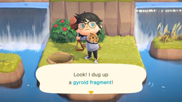 A player having dug up a Gyroid Fragment in Animal Crossing: New Horizons.