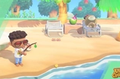 A player is on the decorated beach of their island trying to fish while a resident sunbathes.