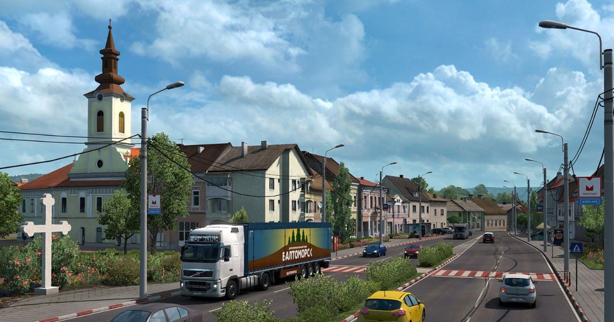 A sunny city with cars in Euro Truck Simulator 2.