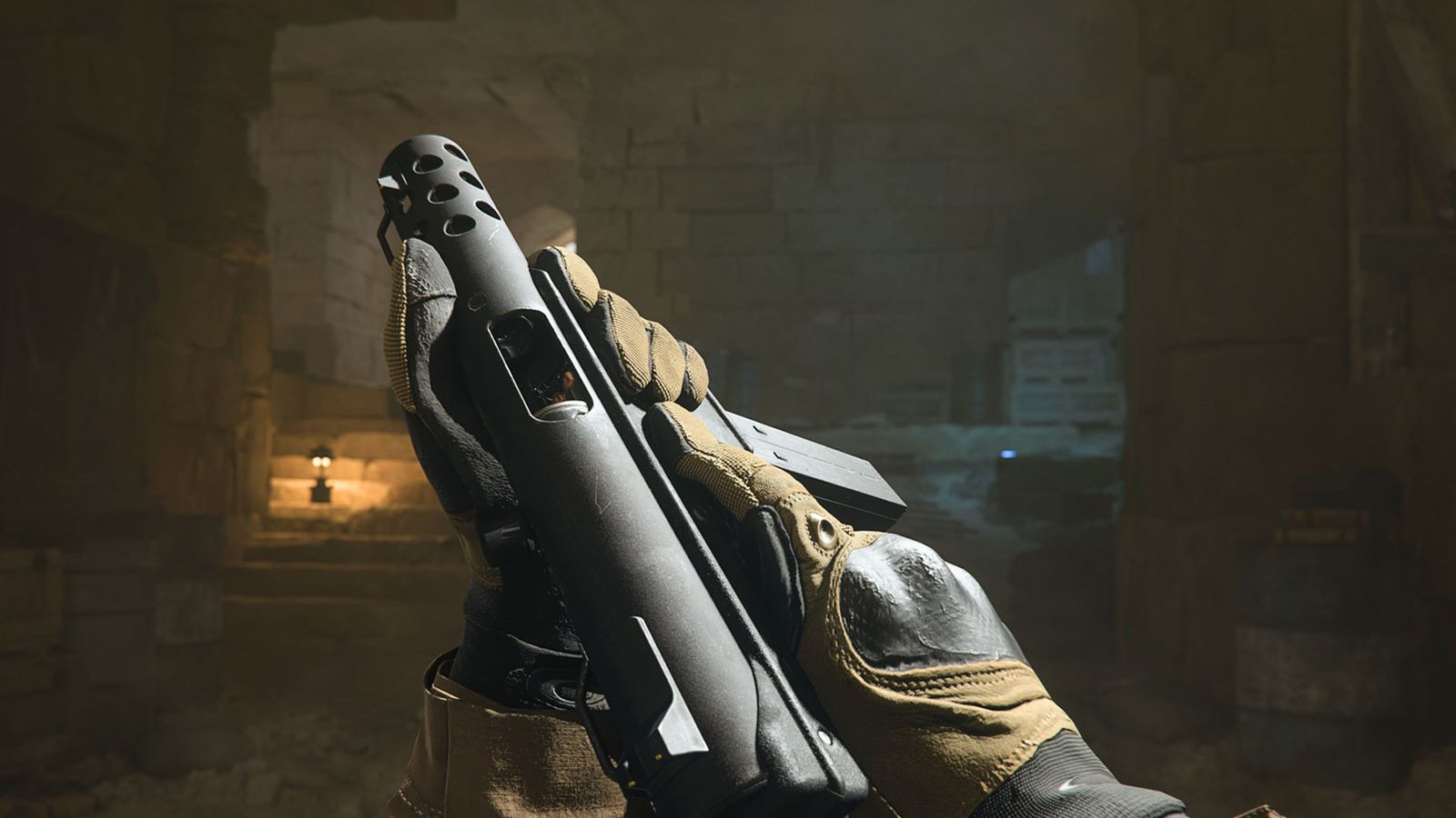 Screenshot of Modern Warfare 2 player holding an FTAC Siege pistol with both hands in dimly lit cave