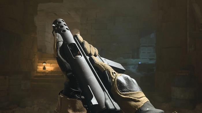 Screenshot of Warzone 2 player holding FTAC Pistol in hands inside a dimly lit cave