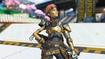 Apex Legends character posing and wearing gold armor