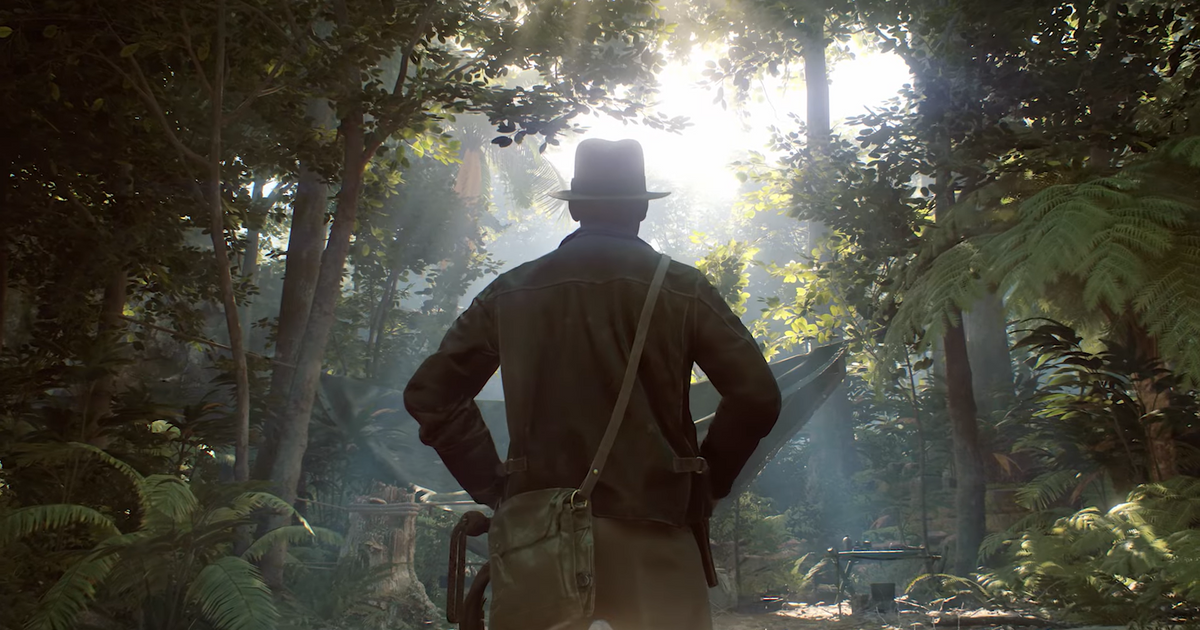 A shot of Indiana Jones's back as he's standing in a forest.