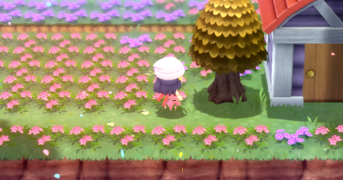 A Pokémon Trainer interacting with a honey tree in Pokémon Brilliant Diamond and Shining Pearl, where bug-types Burmy and Wormadam can be attracted,
