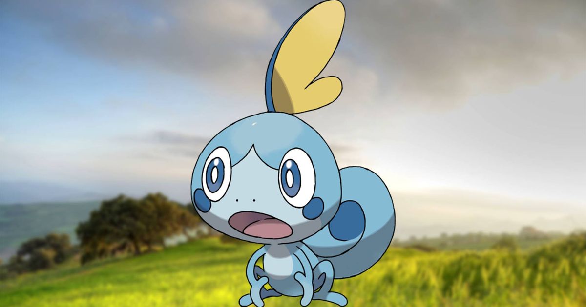 The Pokemon Sobble stood against a grassy hill background.