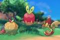 The Pokemon Applin and its evolutions stood on a grassy hill