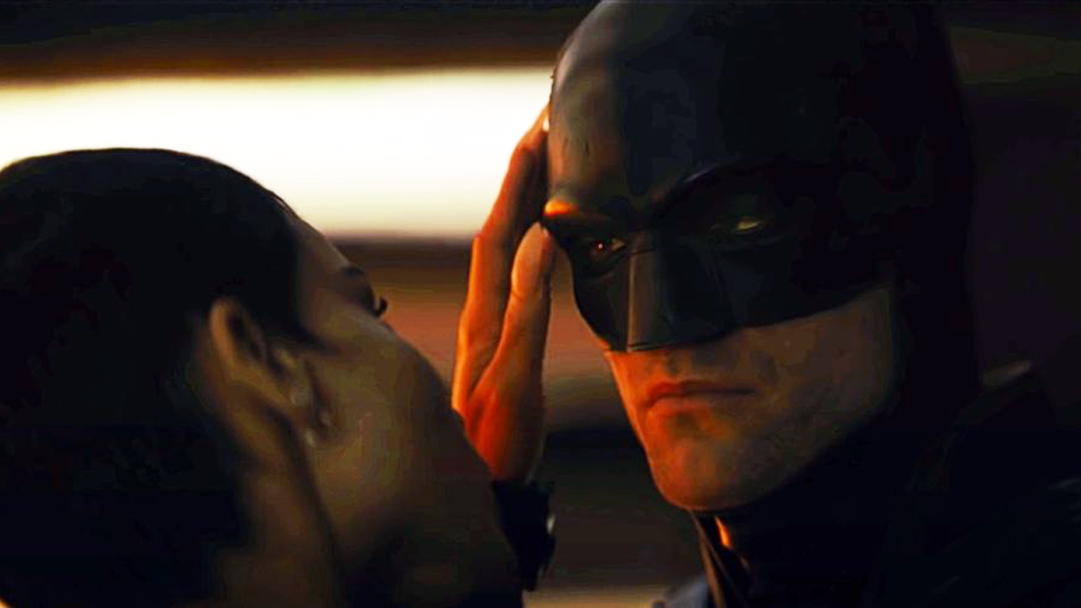 Batman and Catwoman are looking at each other.