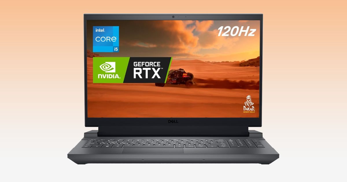 A black laptop with an image of a buggy racing across orange sand dunes on the display.