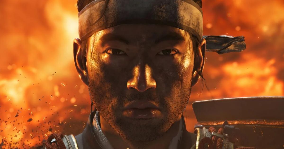 Ghost of Tsushima character close up with fire burning behind