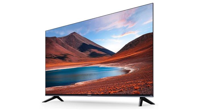 Best cheap 4K TV - Xiaomi F2 Fire TV product image of a thin-framed TV with red mountains and a lake on the display.