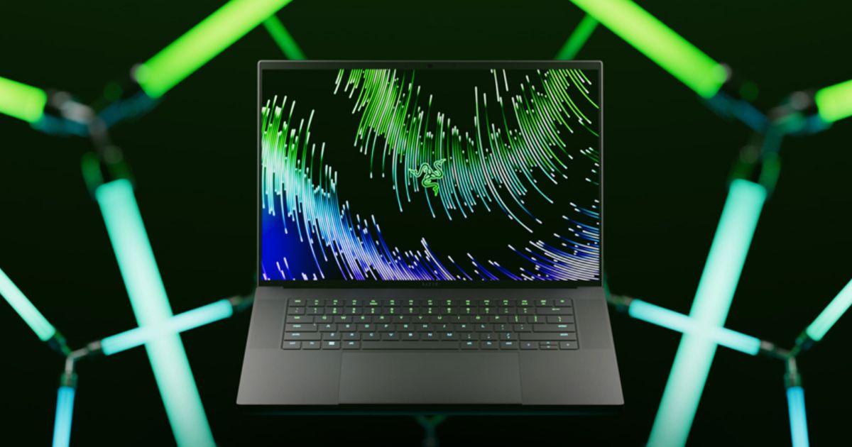 A black gaming laptop featuring a green and blue pattern along with Razer branding in green on the display.