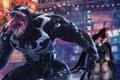 Venom from Marvel’s Spider-Man 2 roaring in Times Square while Stellar Blade’s even hangs out in the background 
