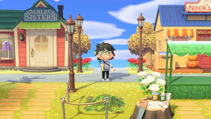 A player outside the Able Sisters and Nooks Cranny shops Animal Crossing: New Horizons.