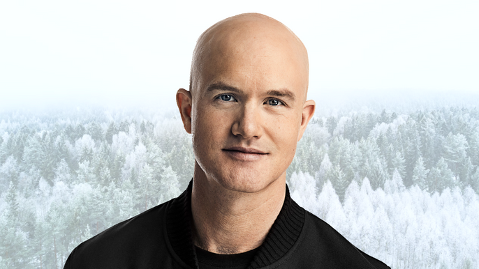 Coinbase CEO in front of a winter background.