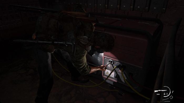 Image of Joel turning on a generator in The Last of Us Part I.