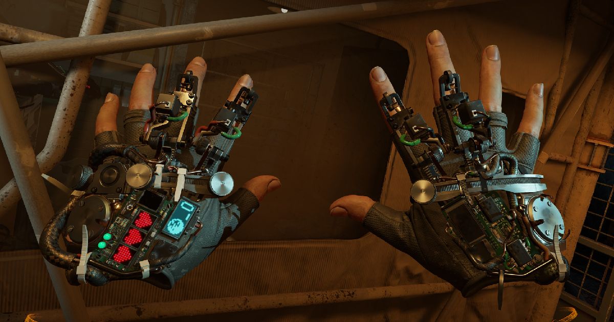A first person shot of someone looking at their hands with mechanical gloves on in Half Life: Alyx