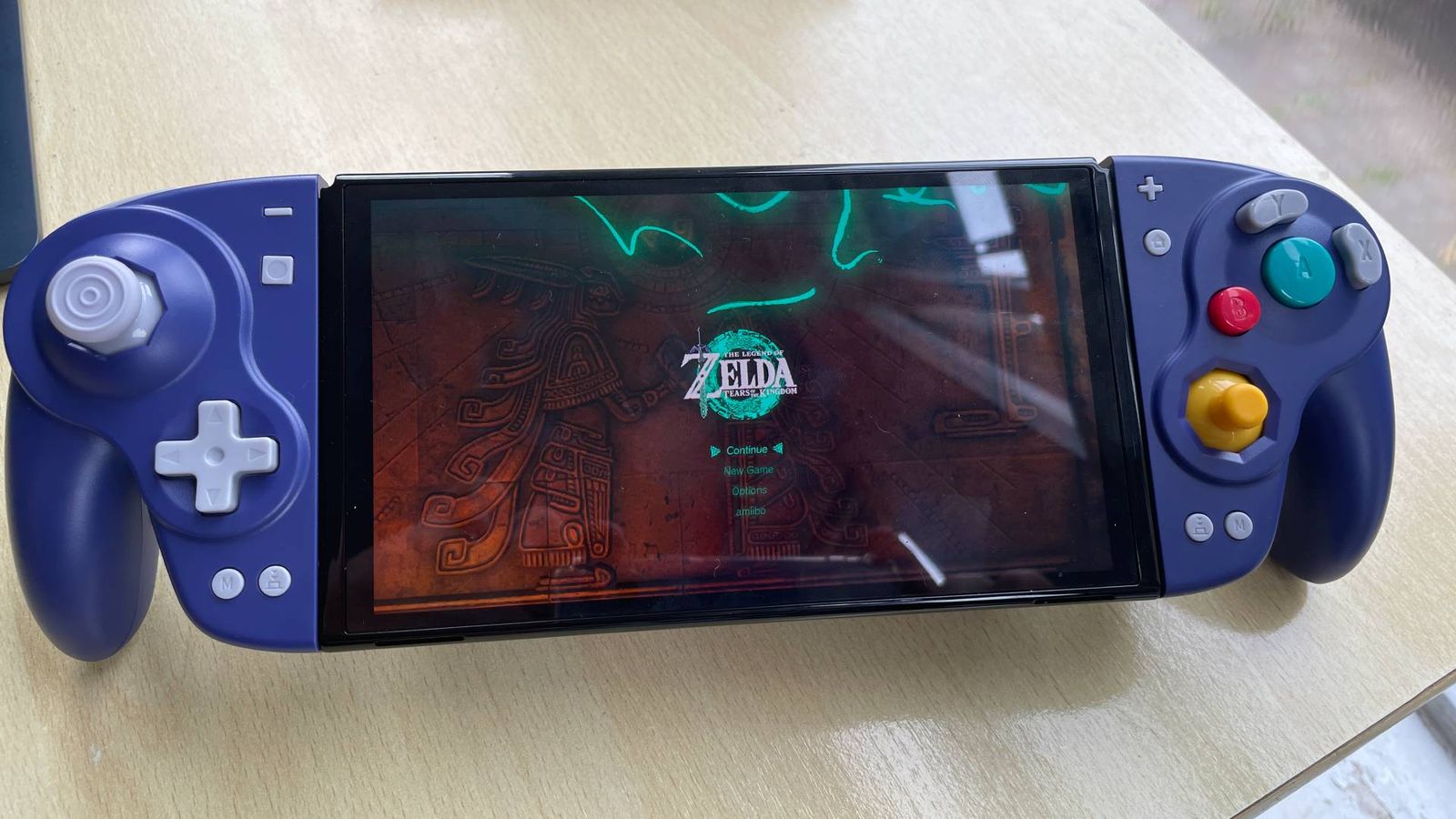 The DOYOKY Wireless Joy-Con retro game controller with a Nintendo Switch running The Legend of Zelda: Tears of the Kingdom.