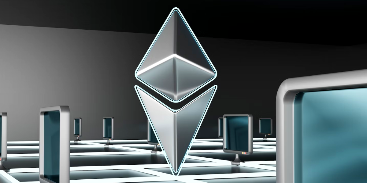 Ethereum logo next to computers.