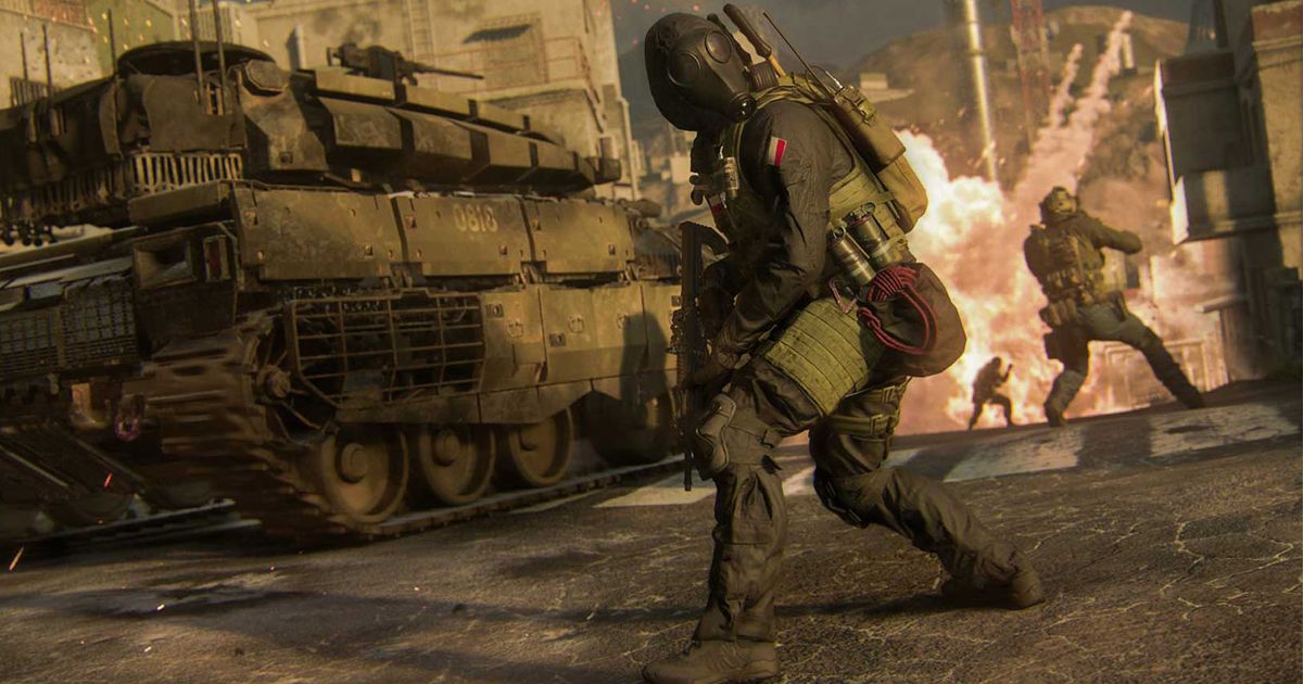 Modern Warfare 3 player standing near tank with squadmates and explosion in background