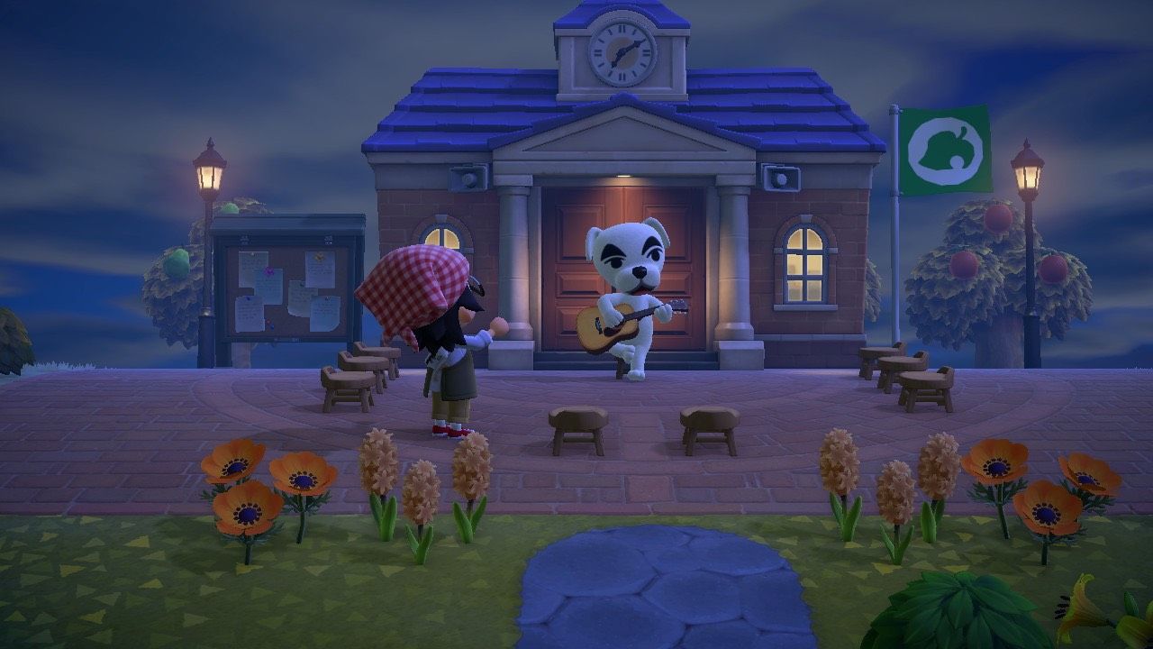A player applauding KK Slider at the Town Hall's Plaza in Animal Crossing: New Horizons.