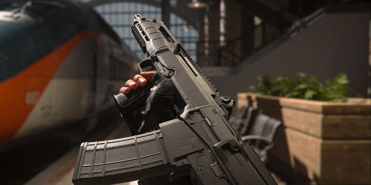 Screenshot of Warzone player holding a Tempus Razorback assault rifle next to a stationary train